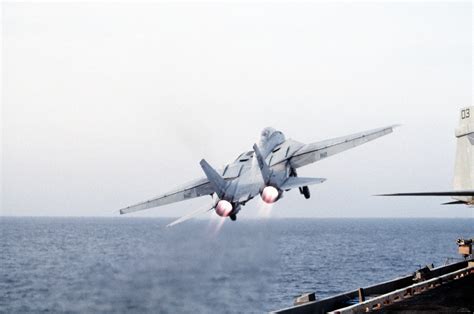 A Fighter Squadron Vf F A Tomcat Aircraft Banks To The Left