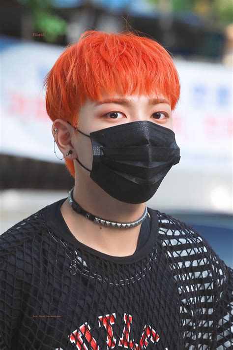 A Boy With Red Hair Wearing A Black Face Mask