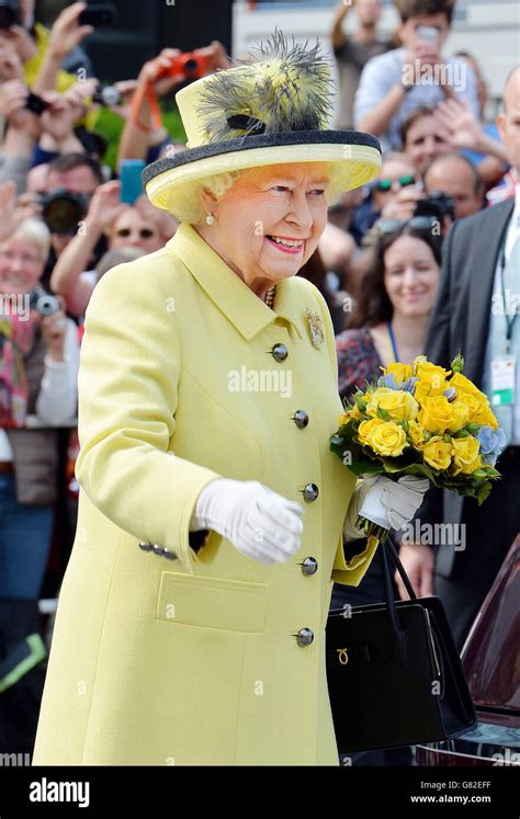 Queen Elizabeth Ii Waves To Well Wishers After A Short Walkabout On The