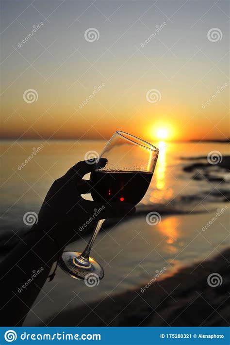 Wine Glasses With Red Wine On Sand On The Beach Stock Image Image Of