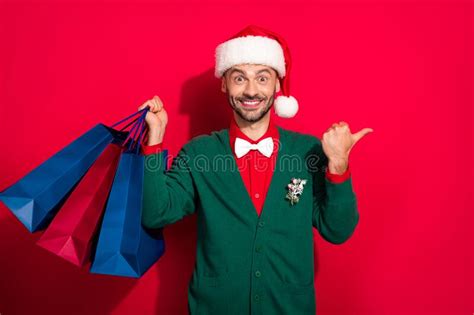 Photo Of Excited Cute Man Wear X Mas Bowtie Green Cardigan Buying Noel Presents Bargains Thumb