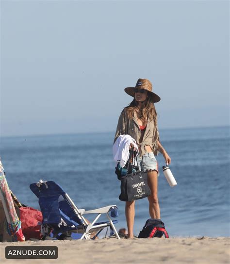 Alessandra Ambrosio Plays Some Paddle Ball With A Friend On The Beach