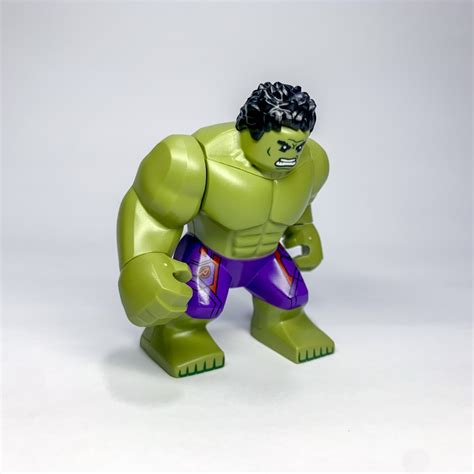 Lego Hulk With Black Hair And Dark Purple Pants With Avengers Logo