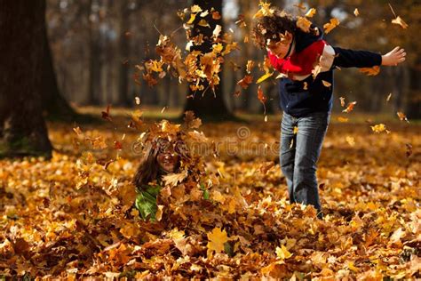 Kids Playing in Autumn Park Stock Photo - Image of fall, colorful: 23097180