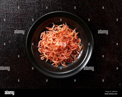 Dried Sakura Shrimps On A Plate Placed On A Black Background Image Of