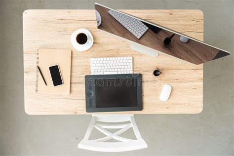 Top View Of Workplace With Computer Smartphone Graphic Tablet And