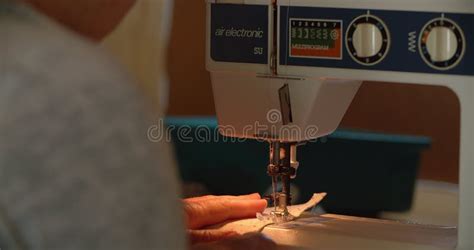 Hands Sewing And Machine With Textile In Workshop Closeup Or