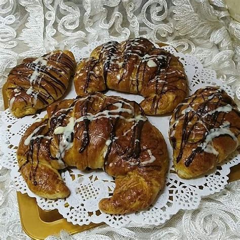 There Are Many Croissants That Have Been Drizzled With Chocolate