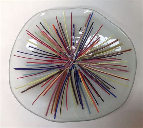 A Glass Plate With Many Colored Sticks In It