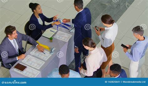 Business People Checking In At Conference Registration Table 4k Stock