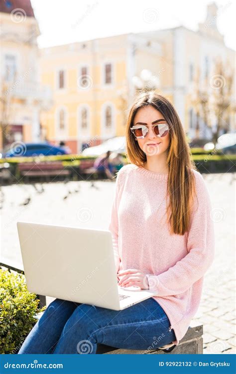 Modern Blogger Side View Of Beautiful Young Woman In Sunglasses Using