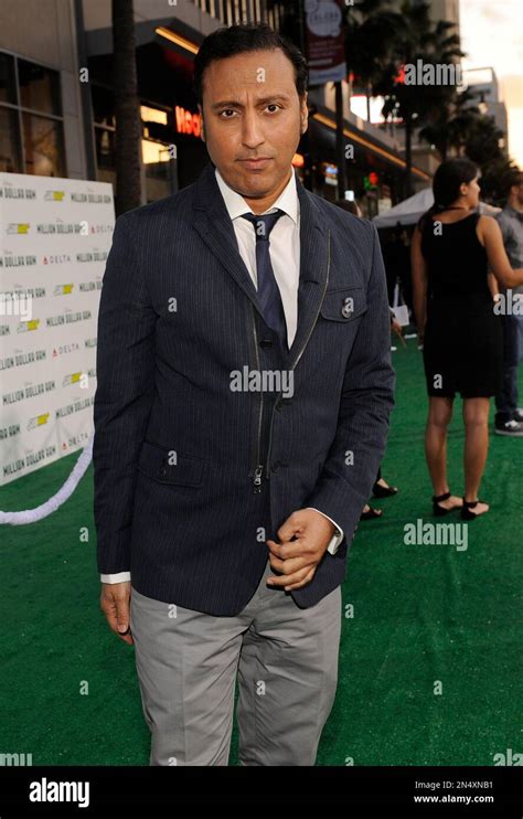 Aasif Mandvi arrives at the world premiere of "Million Dollar Arm" at ...