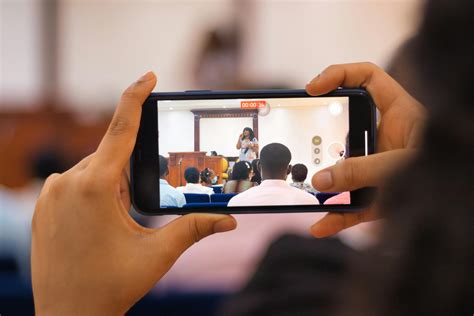 A Woman Recording Herself with a Smartphone · Free Stock Photo