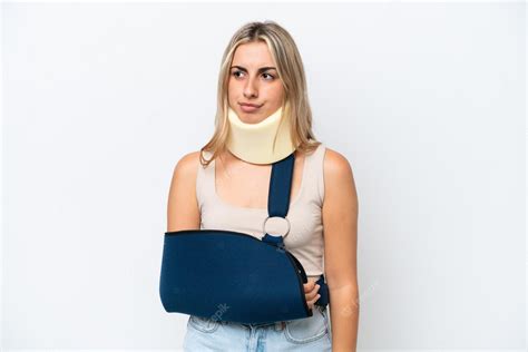 Premium Photo | Woman with broken arm and wearing a sling isolated on ...