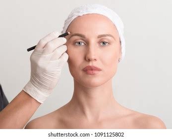 Beautician Touch Draw Correction Lines On Stock Photo