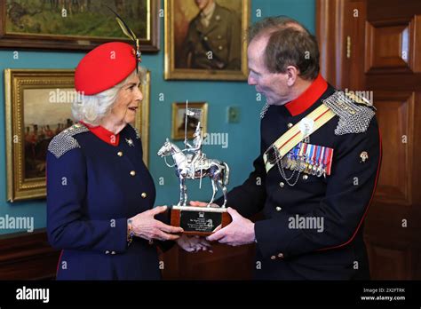 Colonel Richard Charrington Presents Queen Camilla With A Trophy Which