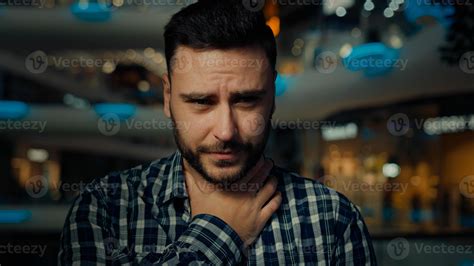 Arabian ethnicity sick ill man touch neck feel pain suffer from