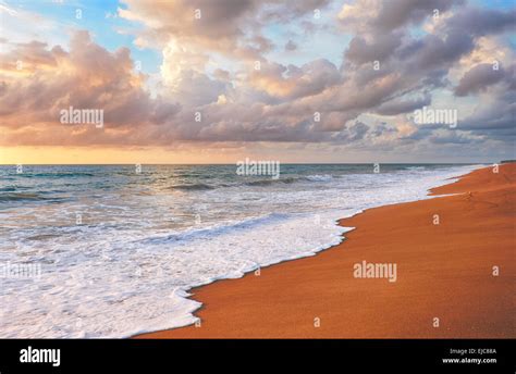 Sunset on Mai Khao beach in Phuket Stock Photo - Alamy