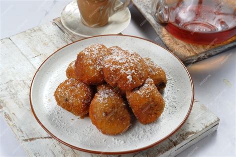 Premium Photo Oliebollen Or Sugared Fried Fritters Traditional Dutch