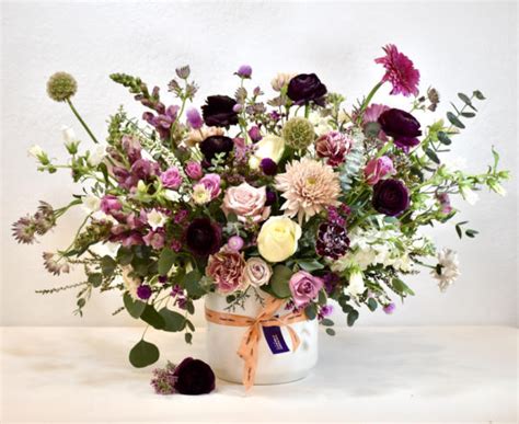 Flower arrangements are shown by size and style, and can be designed in ...