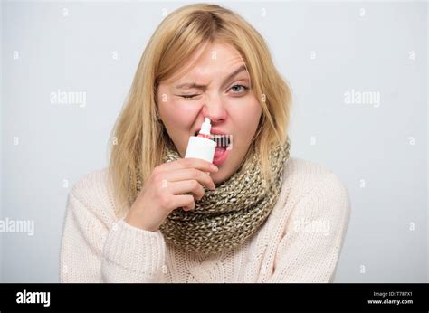 Clearing Up Sick Woman Spraying Medication Into Nose Unhealthy Girl