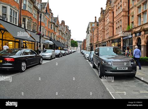 Parked Cars In Busy Street In Mayfair London Uk Stock Photo Alamy