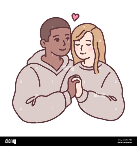 Cute young mixed race couple in love holding hands. Black guy and blonde girl in matching ...