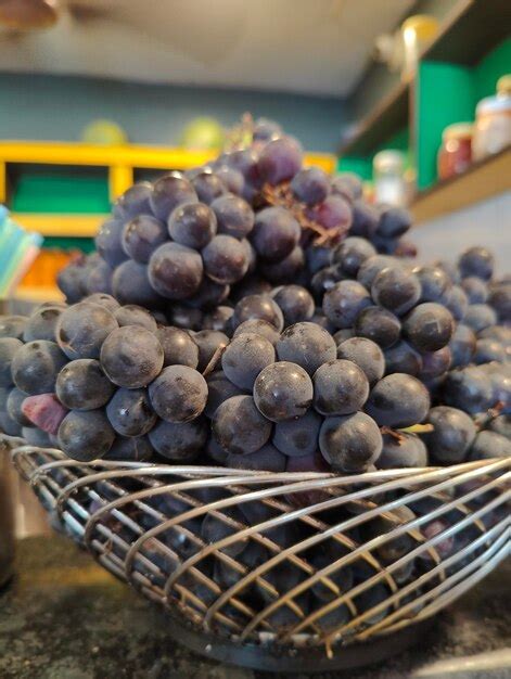 Premium Photo | A basket of grapes with a basket of grapes in it