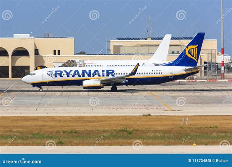 Ryanair Boeing 737-800 Is Landing On Runway 07L In Front Of Parked ...