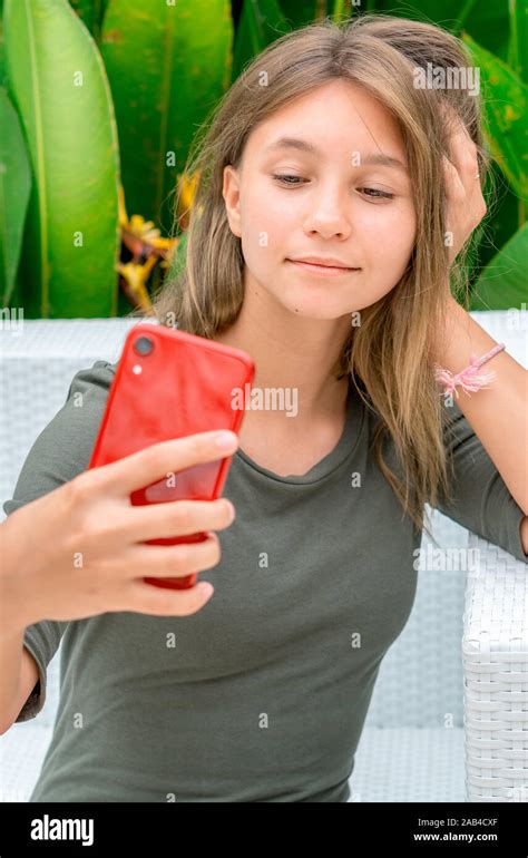 Young Teenage Girl Taking A Selfie With Her Smartphone Stock Photo Alamy