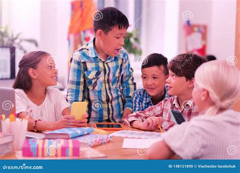 Happy Children Laughing And Joking At School Stock Photo Image Of