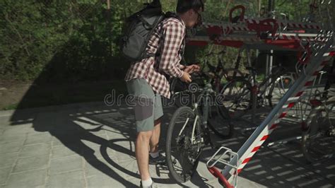 A Man Parks His Bicycle In A Two Level Bicycle Parking Lot In Munich Germany Double Decker