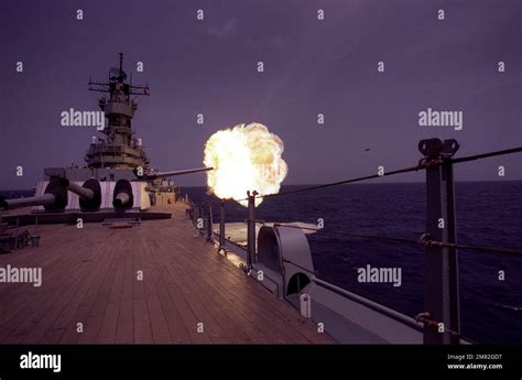 The battleship USS IOWA (BB-61) fires a round from its No. 2 Mark 7 16 ...