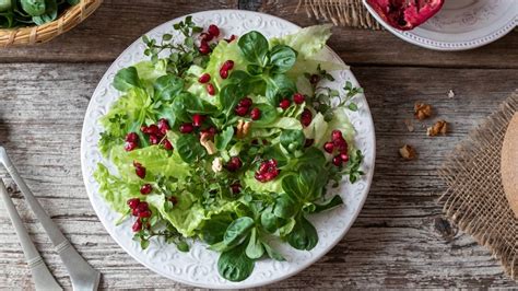 Escarole And Butter Lettuce Salad With Pomegranate Seeds And Hazelnuts - Fresh-Pressed Olive Oil