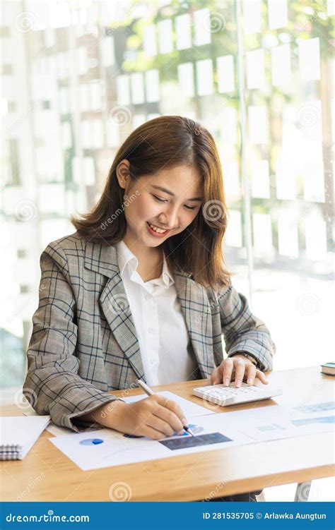 Young Woman Working On Laptop In Office Asian Female Accountant