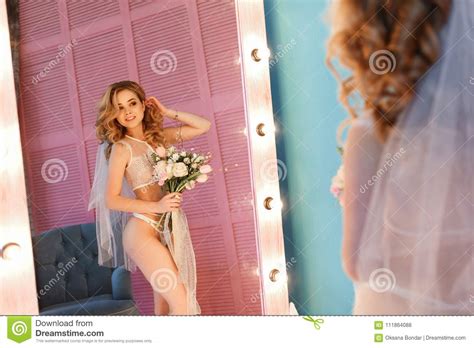 Tender Bride In Lingerie And Veil Looking To Mirror Morning Prepare At