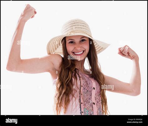 Smiling Woman Flexing Her Muscles Stock Photo Alamy