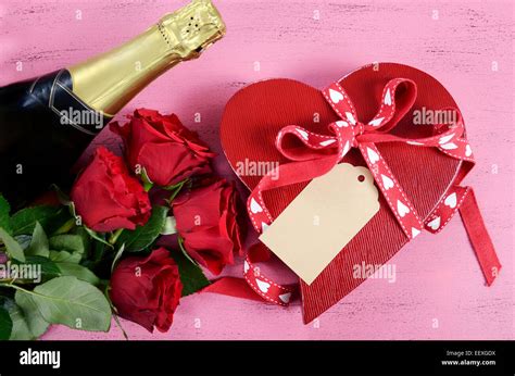 Happy Valentines Day Red Heart Shape Gift Box With Bottle Of Champagne