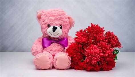 Premium AI Image | A pink teddy bear with a bouquet of red flowers