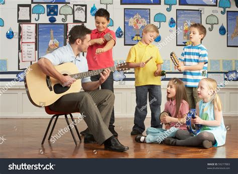 Male Teacher Playing Guitar Pupils Having Stock Photo 59277883