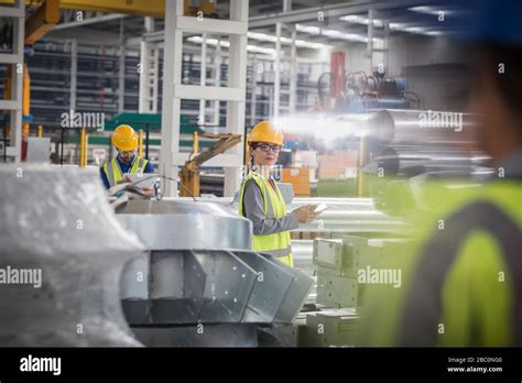 Workers in steel factory Stock Photo - Alamy