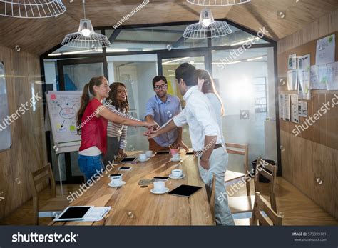 Casual Colleagues Putting Hands Together Office Stock Photo Edit Now