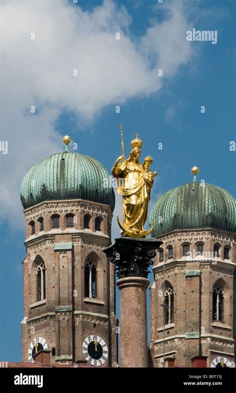 Statue Of St Mary With Frauenkirche Church Of Our Lady In Marienplatz