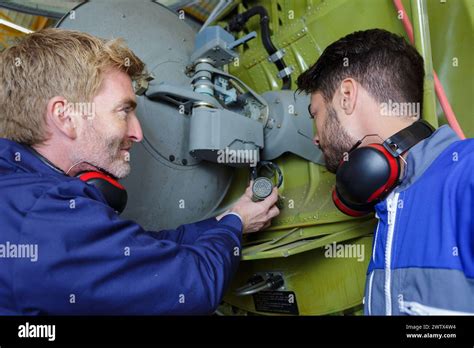 motor mechanic discussing  engineer task stock photo alamy