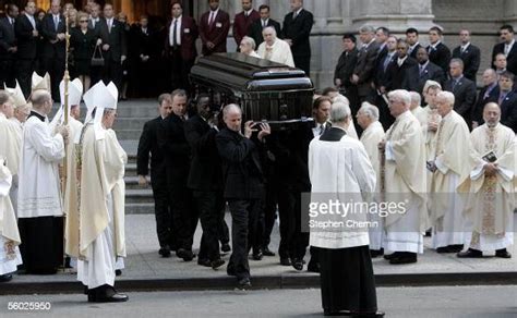 The casket of New York Giants owner Wellington Mara is carried from ...