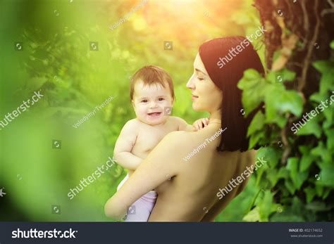 Mother Nude Hugging Smiling Baby Daughter Stock Photo