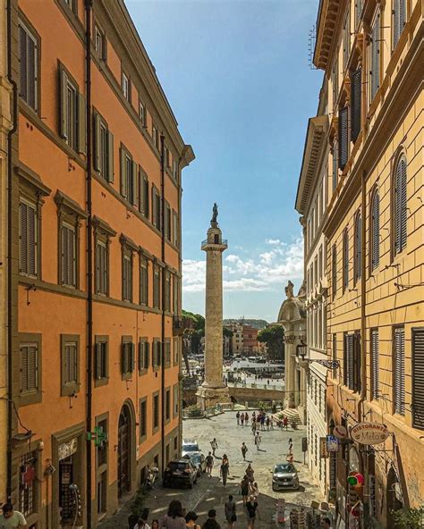 People Are Walking Around In An Old Town