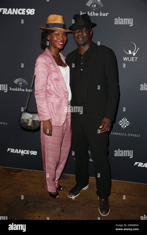 Lilian Thuram et sa compagnie Kareen Guiock participant à la fête