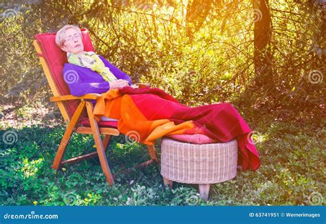 Older Woman Sleeping In Chair In The Garden Stock Image Image Of