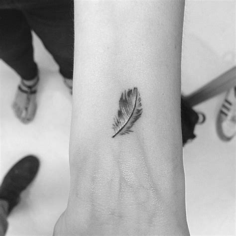 57 Attractive Wrist Feather Tattoos